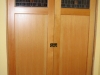 Double pocket door with custom stained glass panels