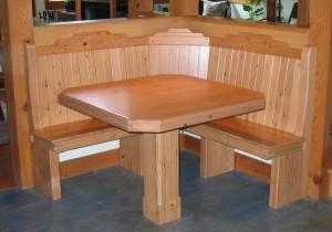 built-in corner bench and single pedestal table